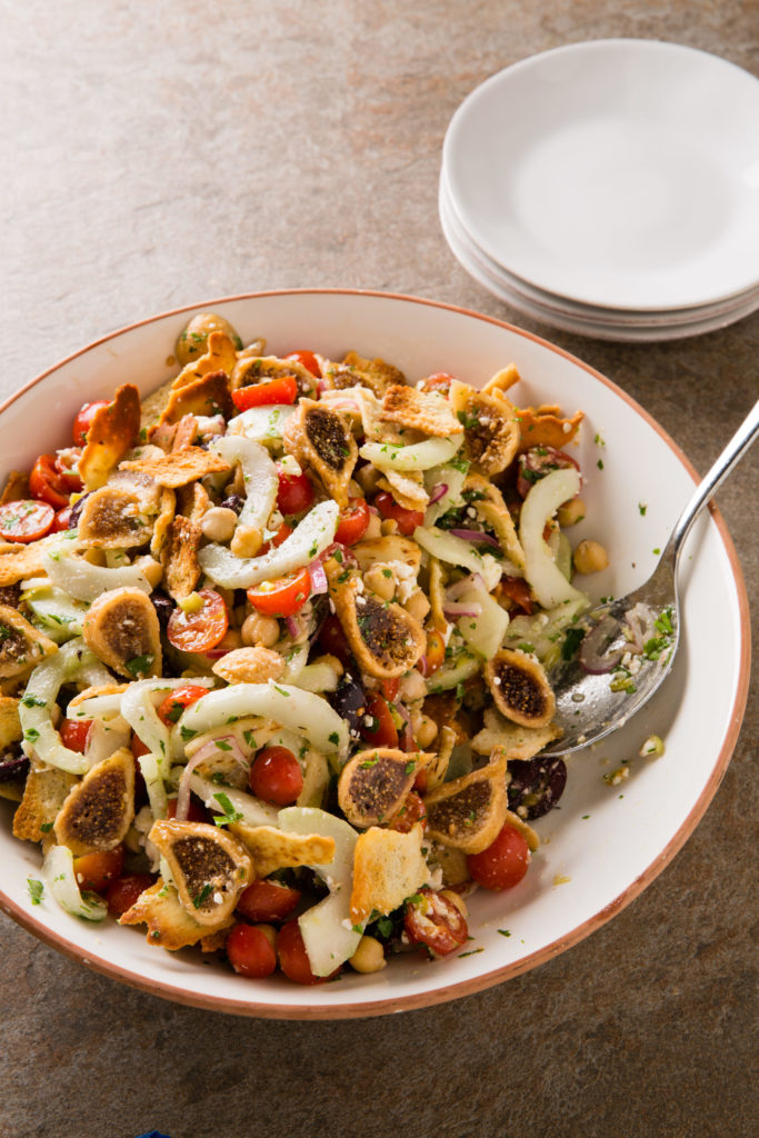 Bread salad, also known as panzanella is reinvented in this Greek Panzanella. Made with pita chips and dried figs, pair it as part of a Mediterranean meze.