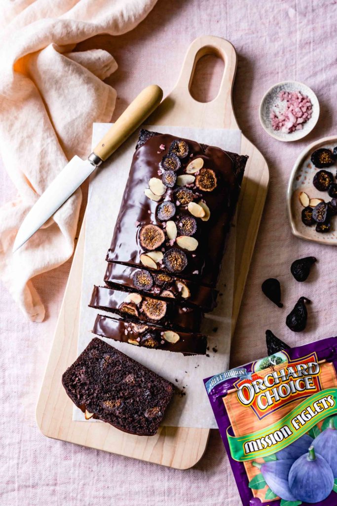 Everyone needs a ringer gluten free chocolate cake recipe. Chocolate ganache ices the top and chewy figs are baked into every bite of this moist loaf cake. 