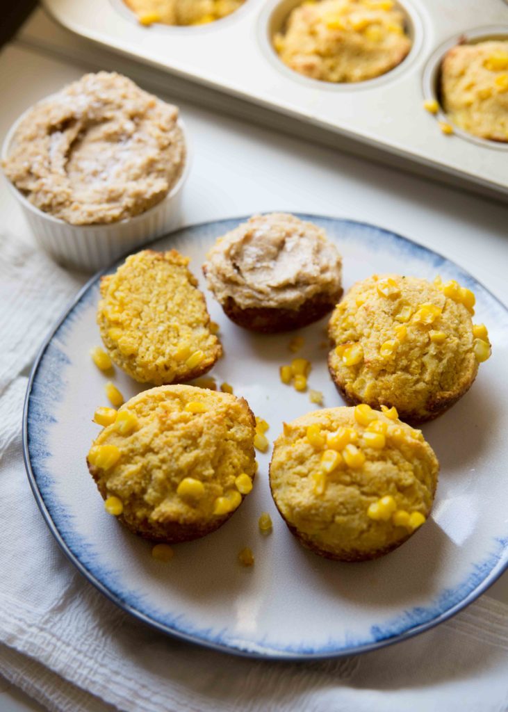Cornbread muffins with honey fig butter are home-baked portability. Made for picnics, potlucks, suppers and cornbread muffins with corn are a crowd-pleaser.