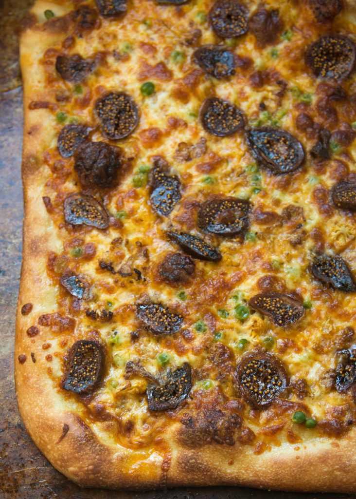 Curry pizza with figs and cauliflower is a vegetarian pizza that's eady in less than 30 minutes. Store-bought pizza dough makes any night pizza night.