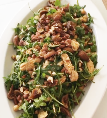 Peppery arugula with chicken and toasted almonds with sweet figs come together with warm spices.