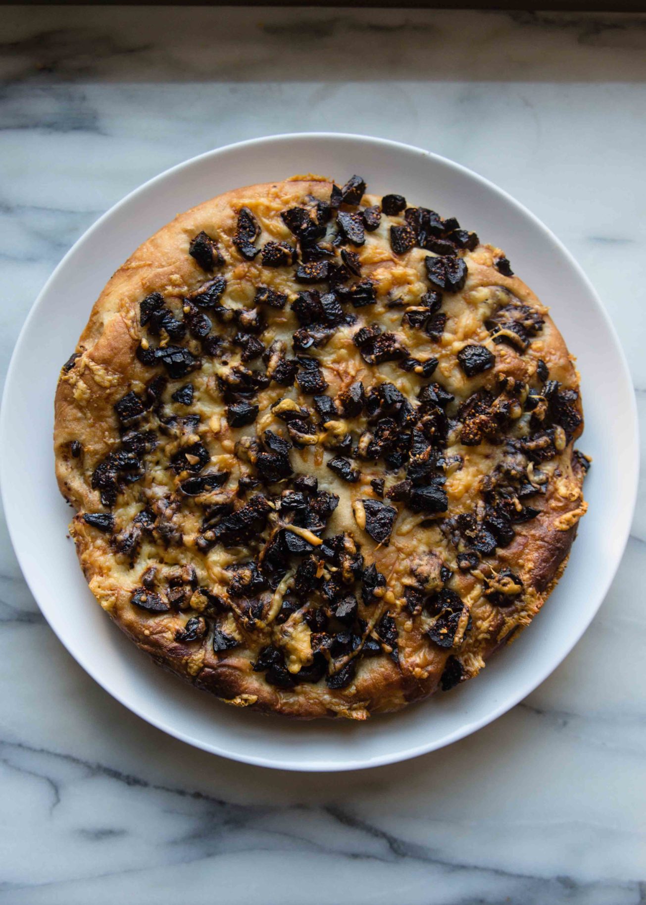 Focaccia recipes bake flatbread to serve in strips as an appetizer or alternative to rolls. Gruyere makes dried fig focaccia perfect for cheese boards.