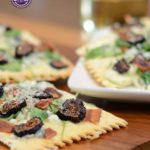 Pizza crackers bring a favorite main dish into hors d'oeuvres territory. Top pizza appetizers with figs, blue cheese, and bacon for a last minute starter.