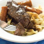 Plate of braised beef short ribs in Guinness with California Dried Figs.