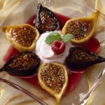 Baked figs with brown sugar is the kind of simple dessert you can enjoy all year long drizzled with raspberry sauce. This recipe shows you how to roast figs.