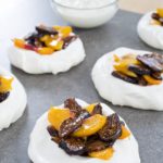 Pavlovas are a naturally gluten-free dessert great year-round. Topped with whipped cream, peaches, and dried figs, learn how to make individual pavlovas