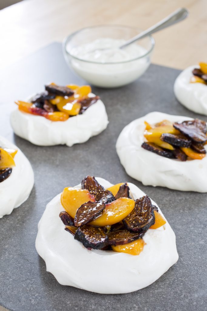 Pavlovas are a naturally gluten-free dessert great year-round. Topped with whipped cream, peaches, and dried figs, learn how to make individual pavlovas