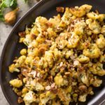 Have you ever tried pan-roasted cauliflower? Cooked with golden figs and almonds with a touch of curry, skillet-roasted cauliflower makes a tasty side dish.