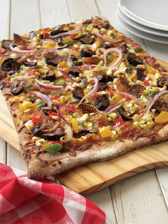 The best vegetarian pizzas come topped with a colorful selection of vegetables like this Greek pizza with figs, feta, and Kalamata olives.