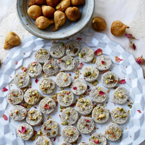Platter of fig pistachio coins with rose water recipe. Persian desserts fpr all year long.