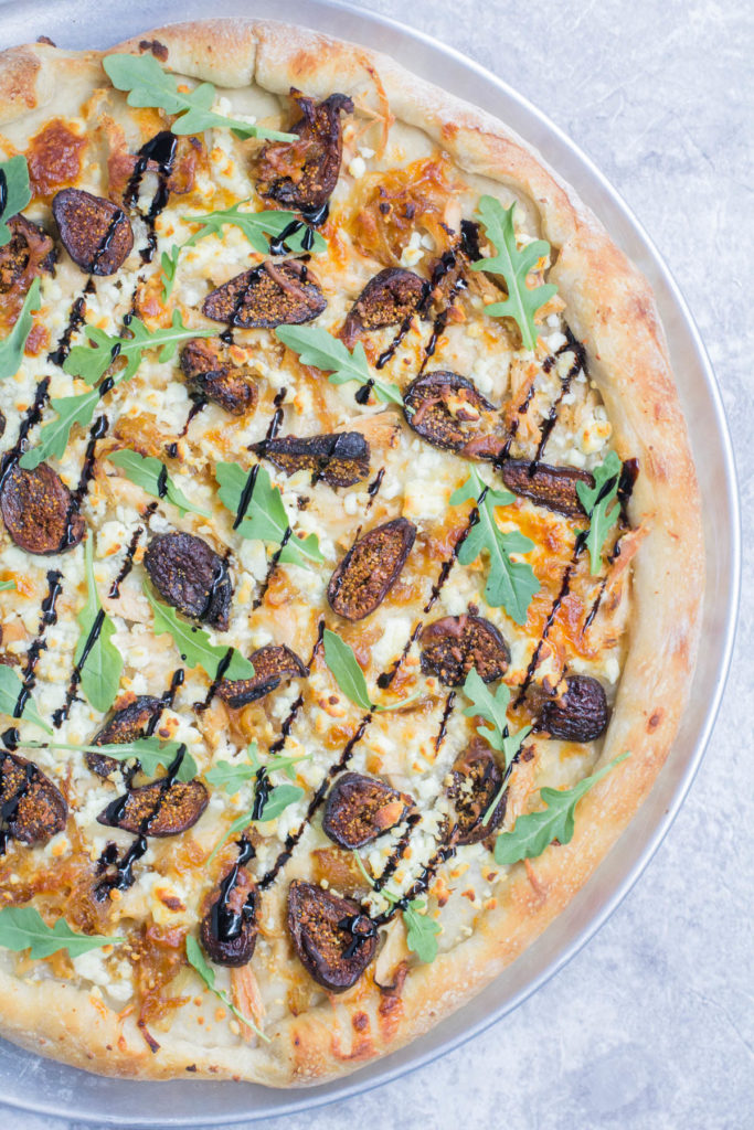 It's pizza night tonight! What makes this goat cheese pizza with figs and chicken unforgettable is the balance of savory ingredients with a balsamic drizzle!