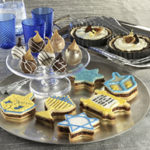 During the festival of lights, bake Hanukkah cookie recipes. Break out the icing to decorate festive Sandwich Hanukkah Cookies.