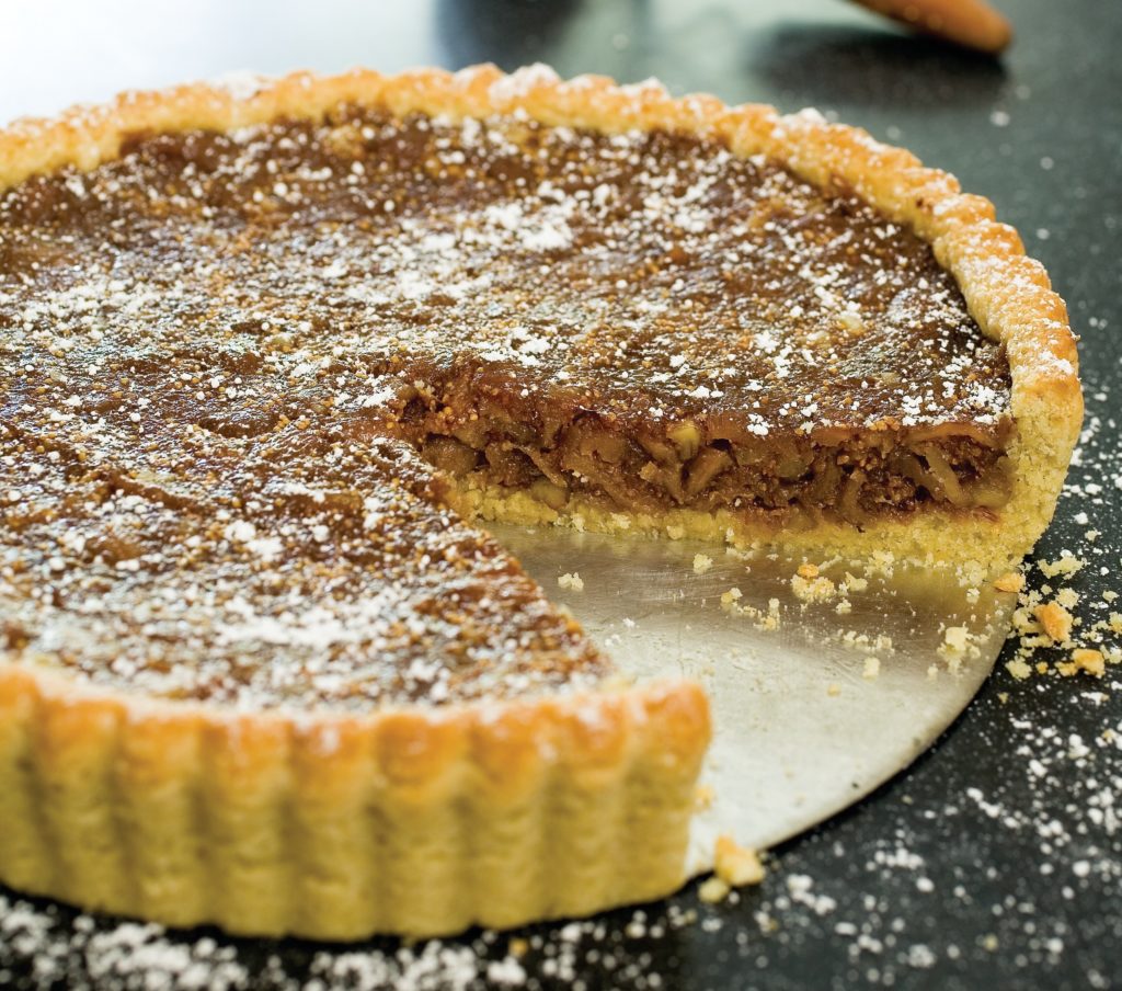 This dried fig tart recipe is perfect all year long. It's an elegant dessert with walnuts as an alternative to pecan pie at Thanksgiving. 