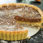 This dried fig tart recipe is perfect all year long. It's an elegant dessert with walnuts as an alternative to pecan pie at Thanksgiving.