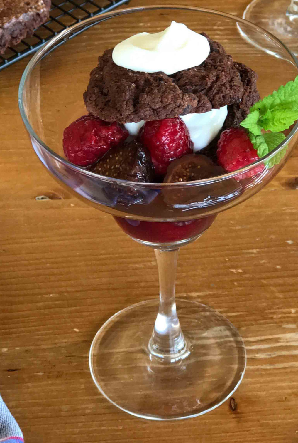 A pretty glass filled with chocolate shortcake with raspberries and figs. Learn how to make the fig compote recipe too.