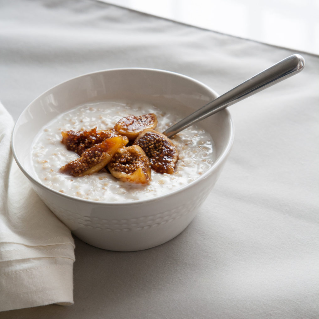 A bowl of creamy oats with honey fig topping