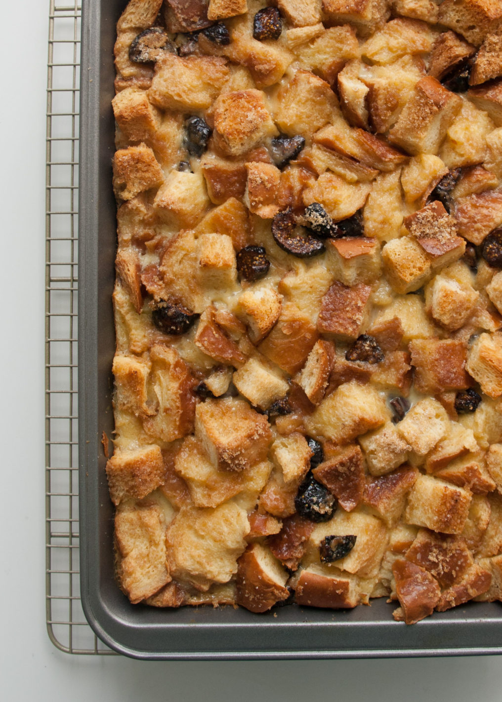 Fig Cognac Bread Pudding in a 13x9 baking dish on a wire rack
