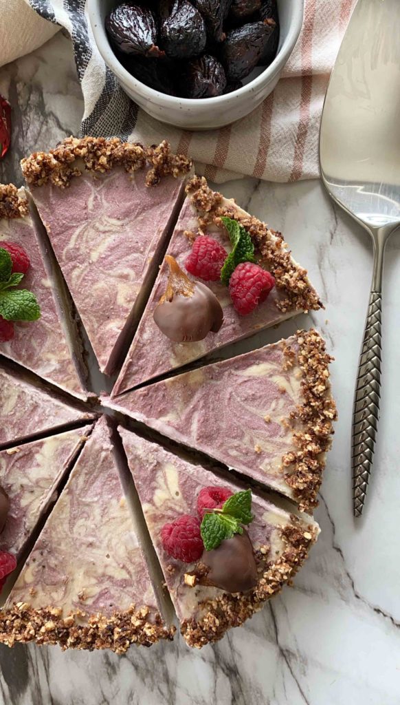 Eating well can include heart healthy dessert recipes. This no-bake vegan cheesecake with fig crust and berries is a sweet treat.