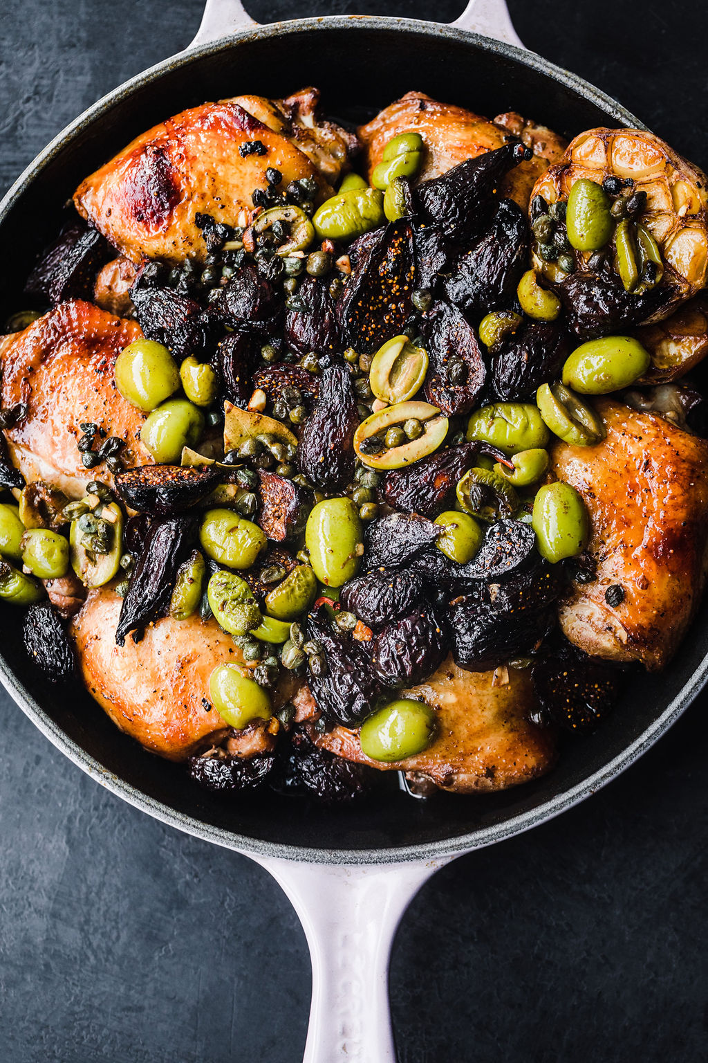 Chicken marbella with olives and figs is deceptively easy to make. Marinate the fig chicken thighs and then bake for feel-good comfort food.