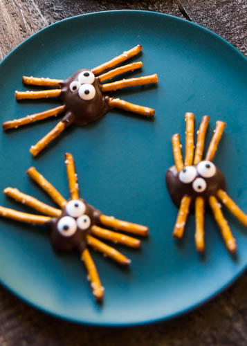 Make your own Halloween candy. Spooky chocolate covered figs transform into pretzel spiders that are creepy fun to create and wickedly delicious.