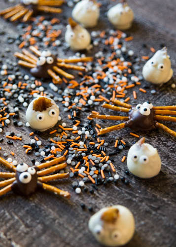 For the candy ghosts, we used good white chocolate chips and achieved ghostly perfection of figs in white chocolate. Semisweet chocolate chips enrobed the chocolate covered figs for the pretzel spiders, though you could use dark chocolate.