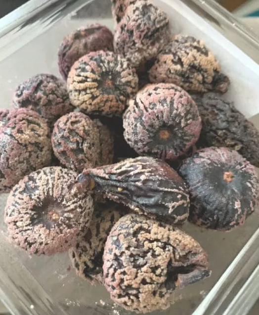 white powder on dried figs