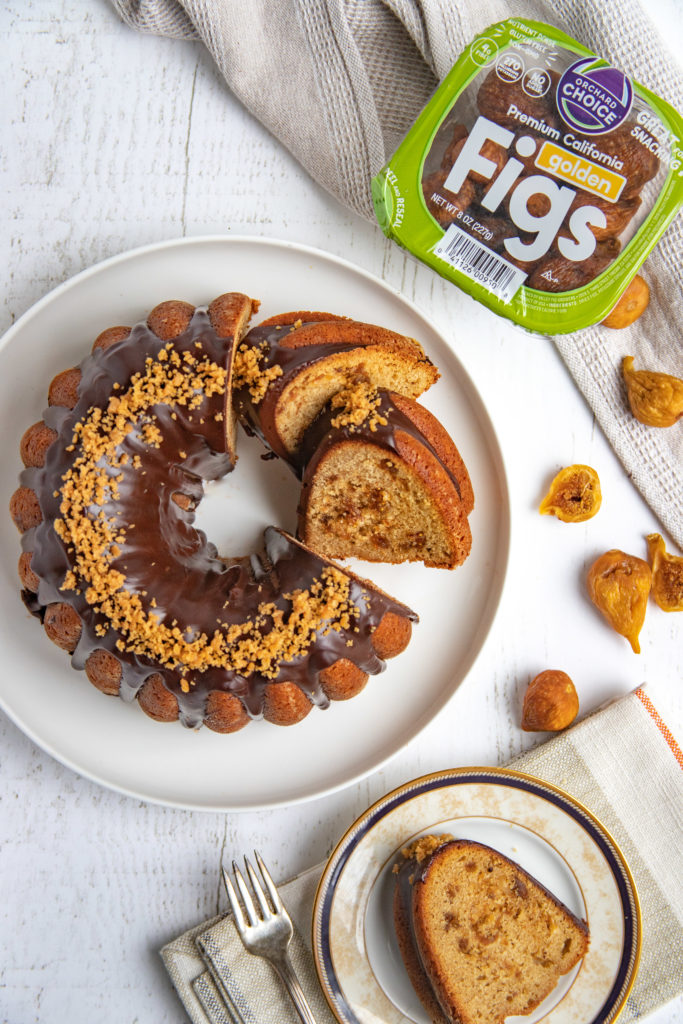 Hazelnut fig swirl and fig jam are the surprise inside this fig bundt cake topped with chocolate glaze ganache. This is a special occasion or any occasion cake.