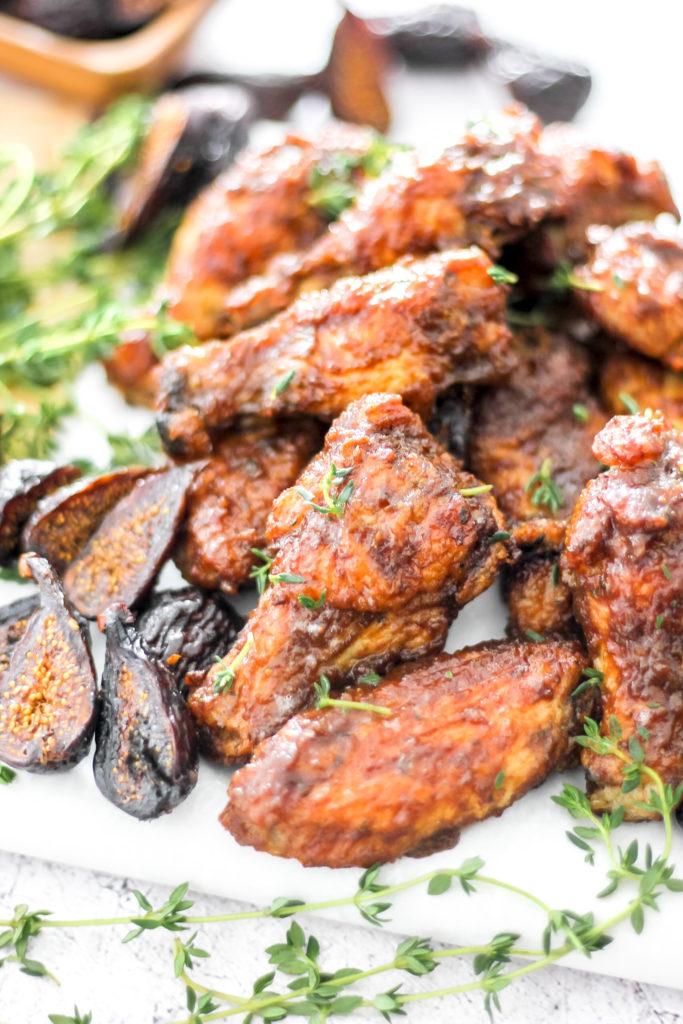 Balsamic fig chicken wings on a platter ready for a chicken wing dinner.
