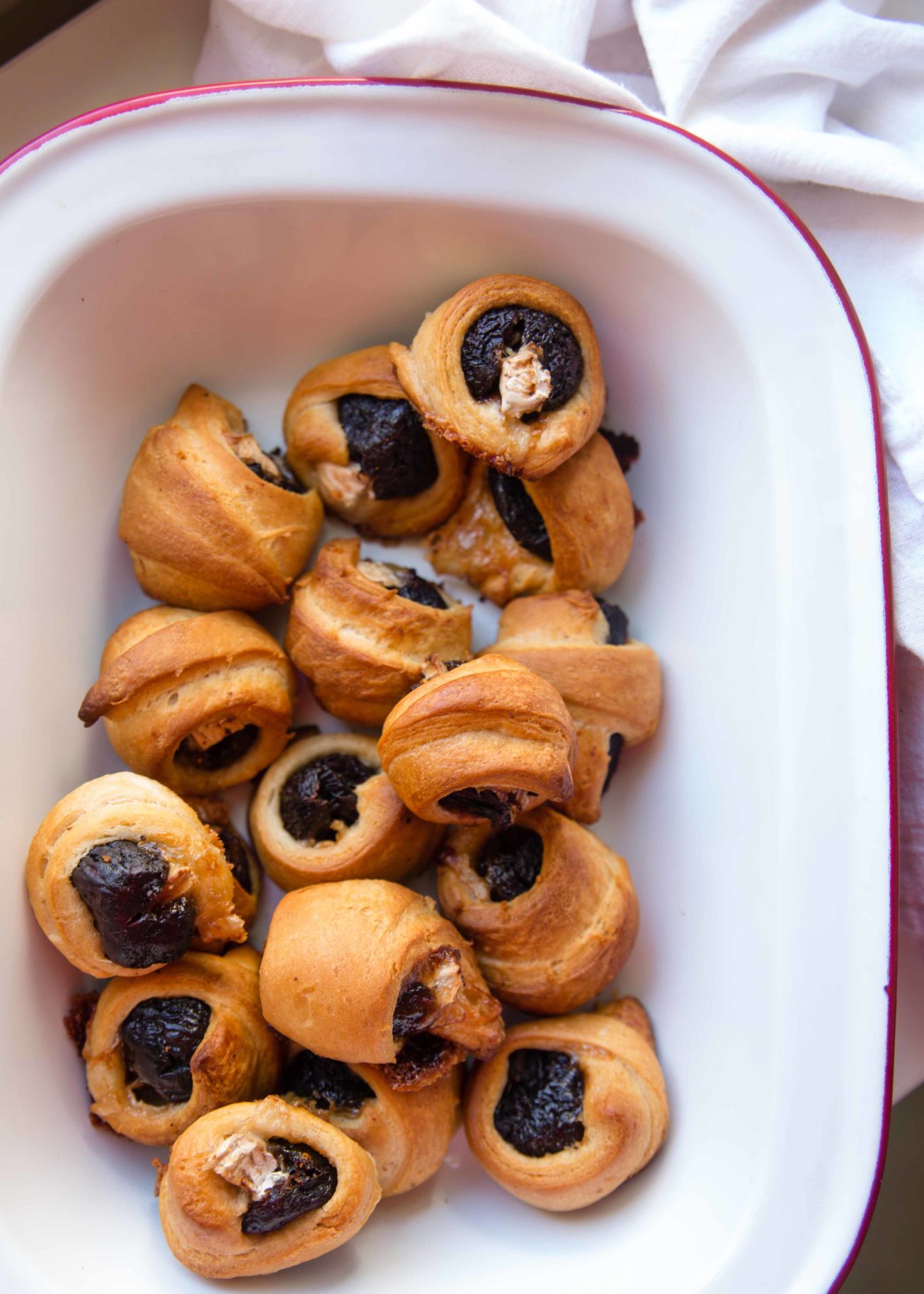 Pigs in a blanket, but better—figs in a blanket baked brie crescent rolls will make you melt. Snack on fig + brie baked in crescent rolls.