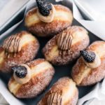 Box of chocolate fig pastry cream filled churro yeasted donuts