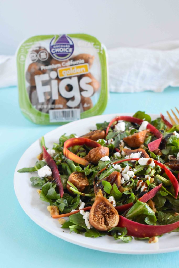 A plate of fig salad with a package of Orchard Choice California Golden Dried Figs