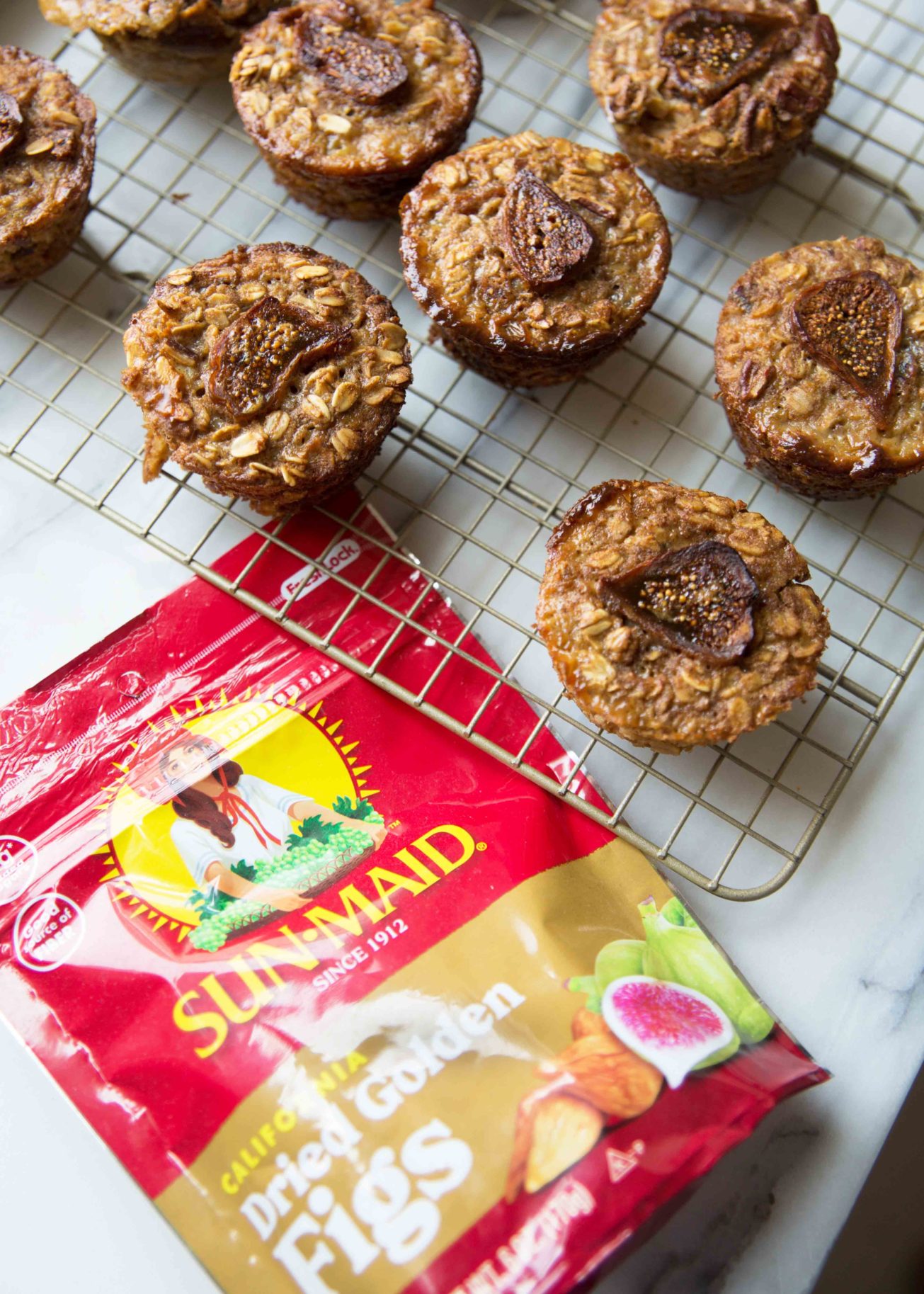 Chai spiced pre-portioned baked oatmeal on a wire rack with a bag of Sun-Maid Golden Figs