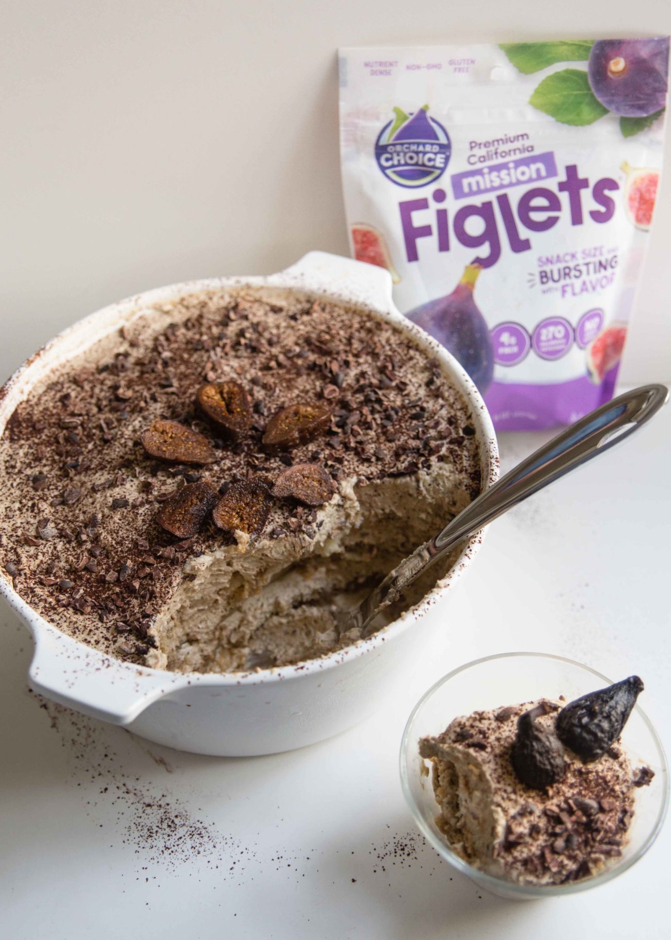 A bowl of an authentic tiramisu recipe and glass cup of fig tiramisu with a bag of Orchard Choice Figlets