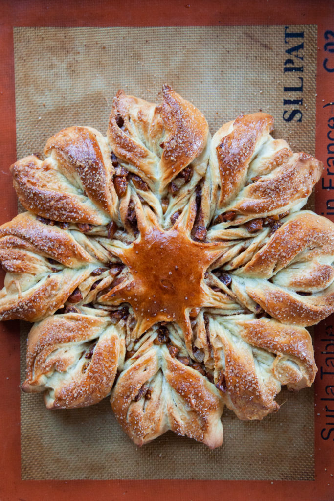 FIg cinnamon star bread recipe fully baked and on a silicone mat.