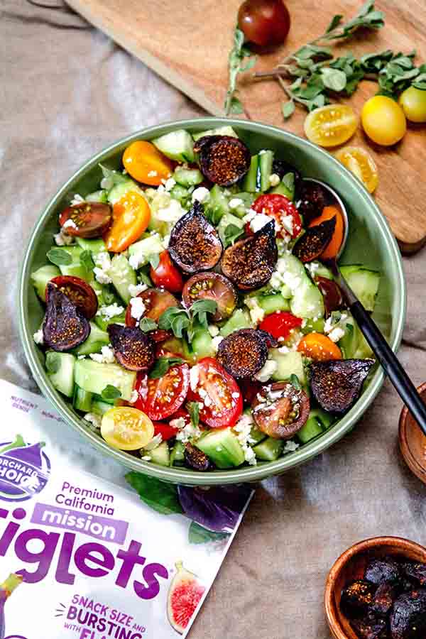 Our chopped Israeli salad with feta mixes dried figs with fresh herbs, cucumber, and tomato. This salad is refreshing and perfect for summer.