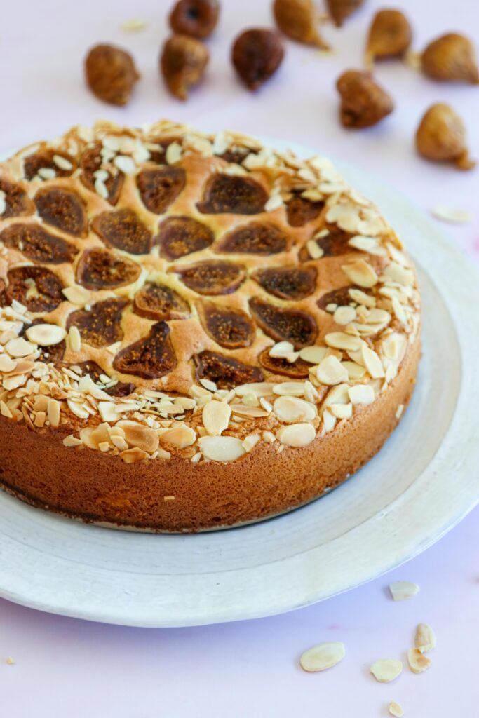 A close-up of flourless fig cake with almonds