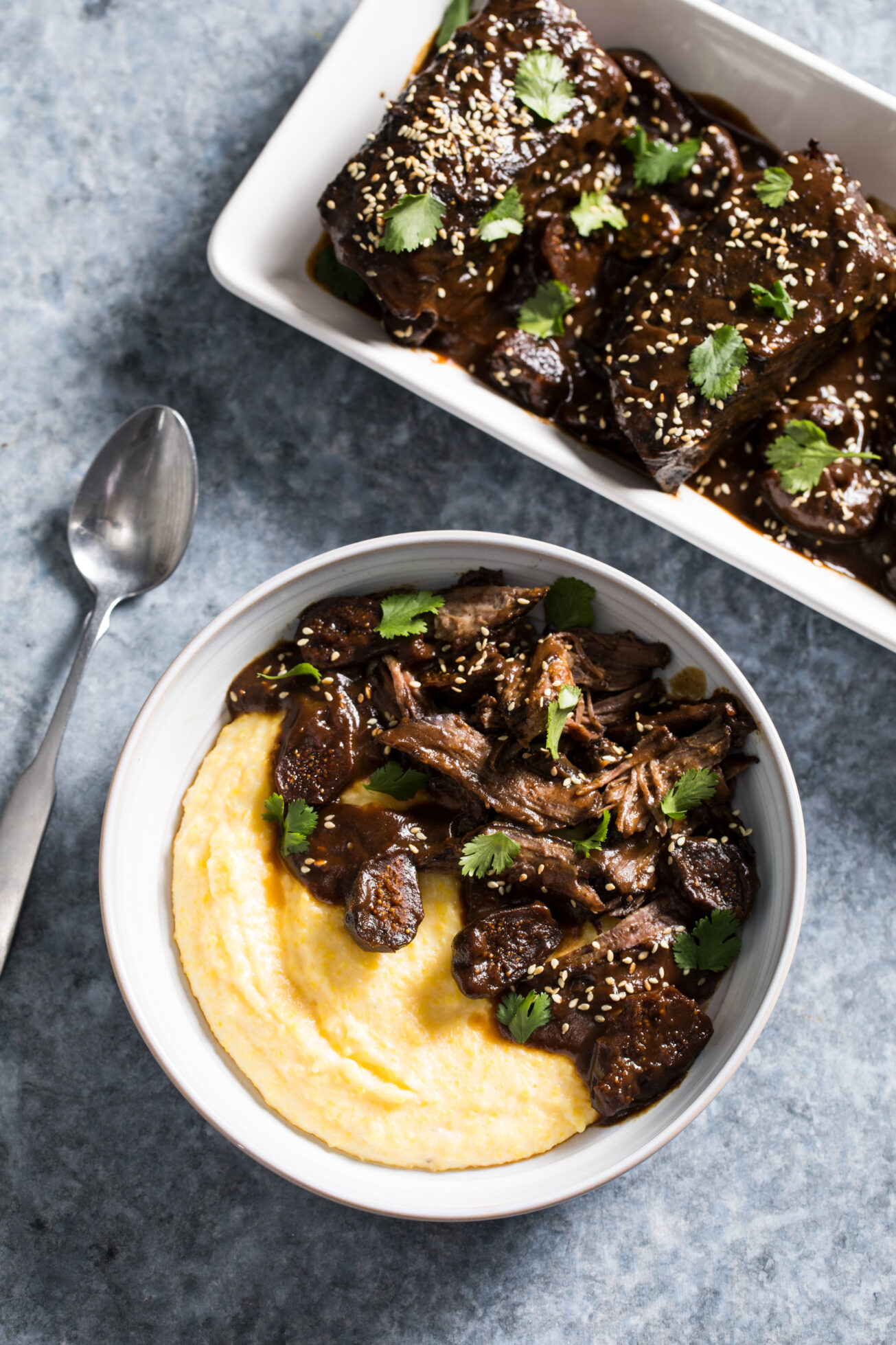 Bring the restaurant home in a tender pomegranate oven braised short rib recipe. Mediterranean spices and figs add nuance to the recipe for braised beef short ribs.