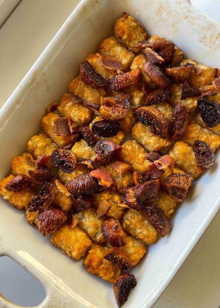 Cheesy with flecks of fig and bacon, this tater tot casserole is about everything you could want in a side dish with crunchy potatoes at the center. 