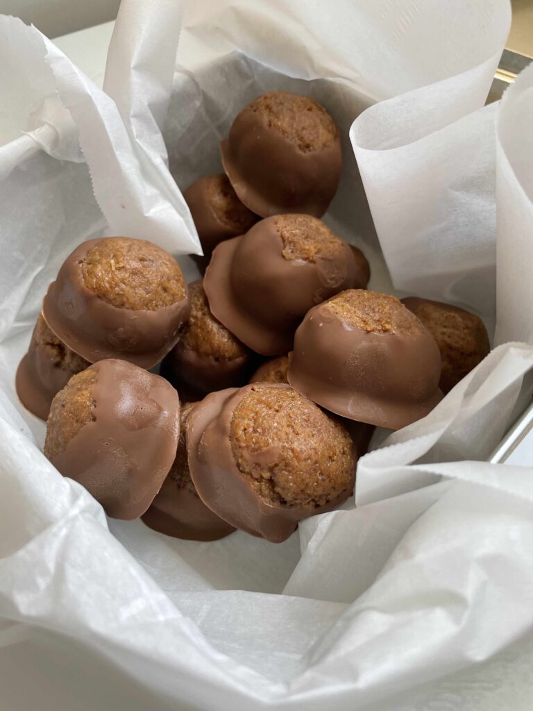 Start a tradition with candy buckeyes. Our buckeye recipe is a great holiday gift! Try almond butter fig buckeye candy recipe, in chocolate.