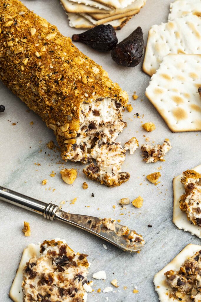 A goat cheese log appetizer is holiday-ready—the goat cheese log recipe with figs + hazelnut-nigella dukkah is an easy make-ahead appetizer.