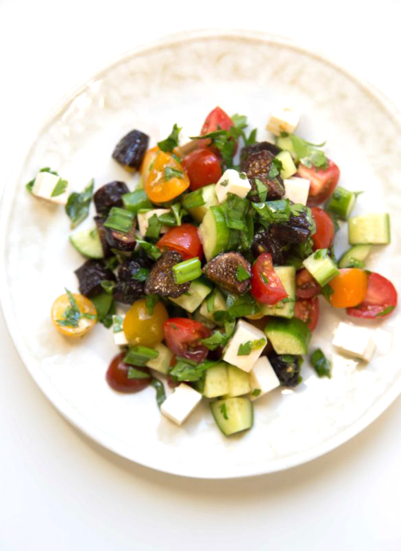Chopped Israeli salad mixes dried figs with fresh herbs, cucumber, and tomato. Israeli salad with feta is refreshing and perfect for summer.