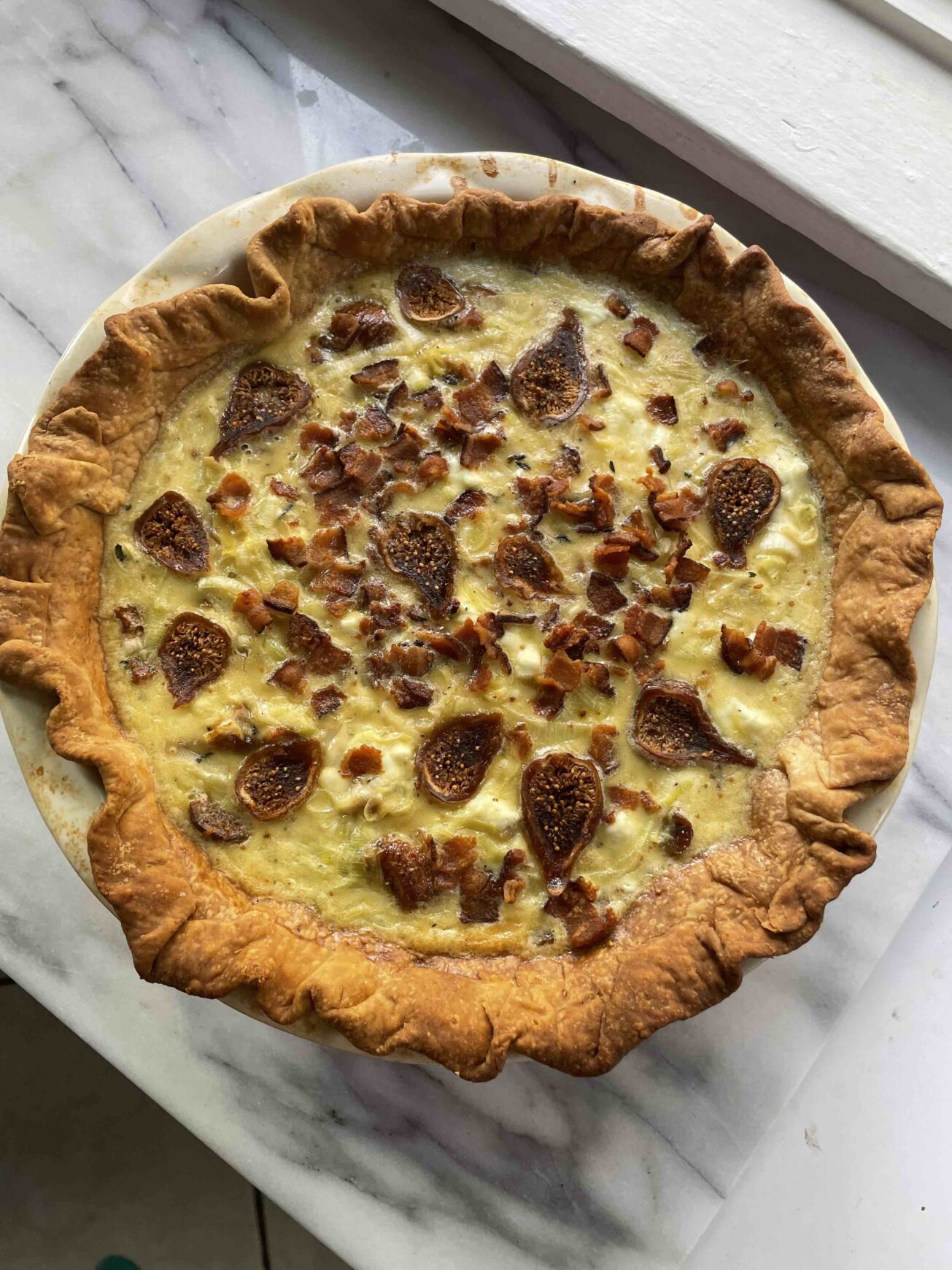 leek goat cheese quiche with golden figs and bacon