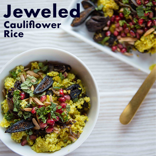 Vegan fig recipes: bowl of riced cauliflower topped with pomegranate arils and figs