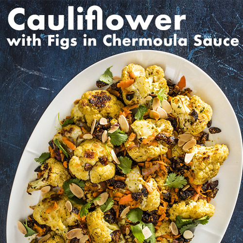 platter of cauliflower in chermoula sauce with figs
