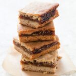 Are fig bars healthy - a stack of fig bars on a square of parchment on a white surface