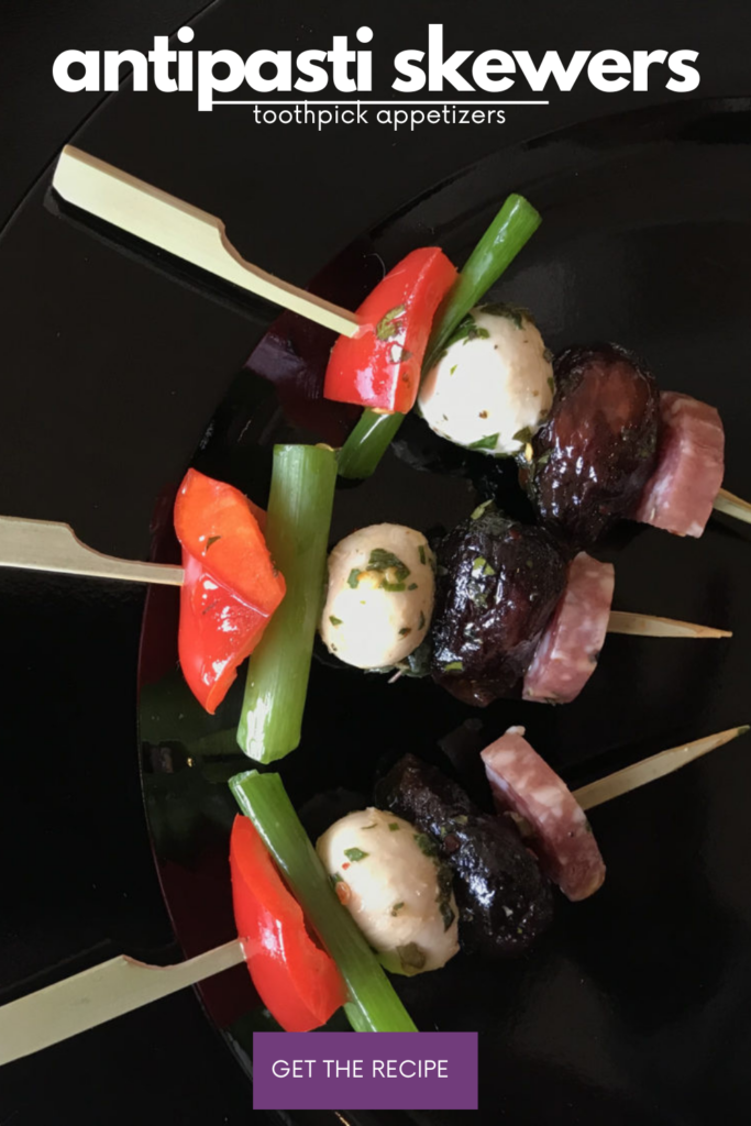 mini skewers of figs, salty meat, marinated mozzarella balls, and red pepper