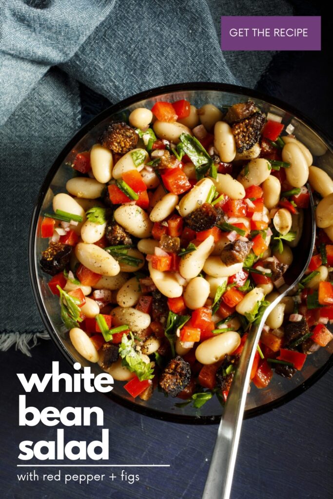 white bean salad on black bowl