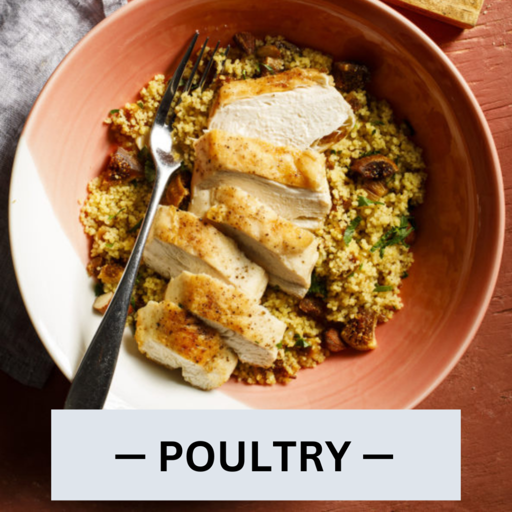 foods to eat on mediterranean diet: pink bowl with couscous and sliced chicken on top | healthy mediterranean food