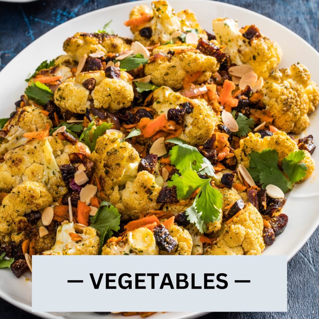 roasted cauliflower with chermoula, carrots, and figs in a white dish | | mediterranean diet what to eat