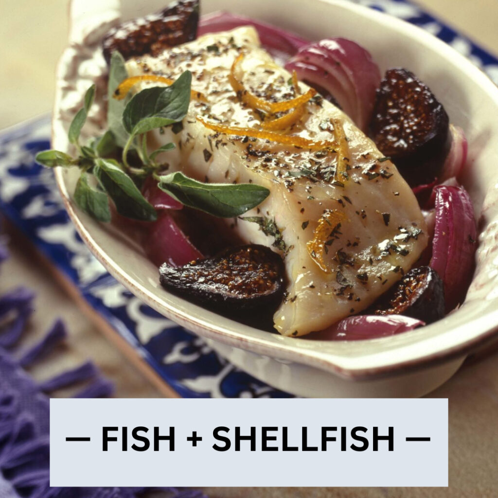 oven-roasted halibut in a le creuset baking dish with figs and onions
